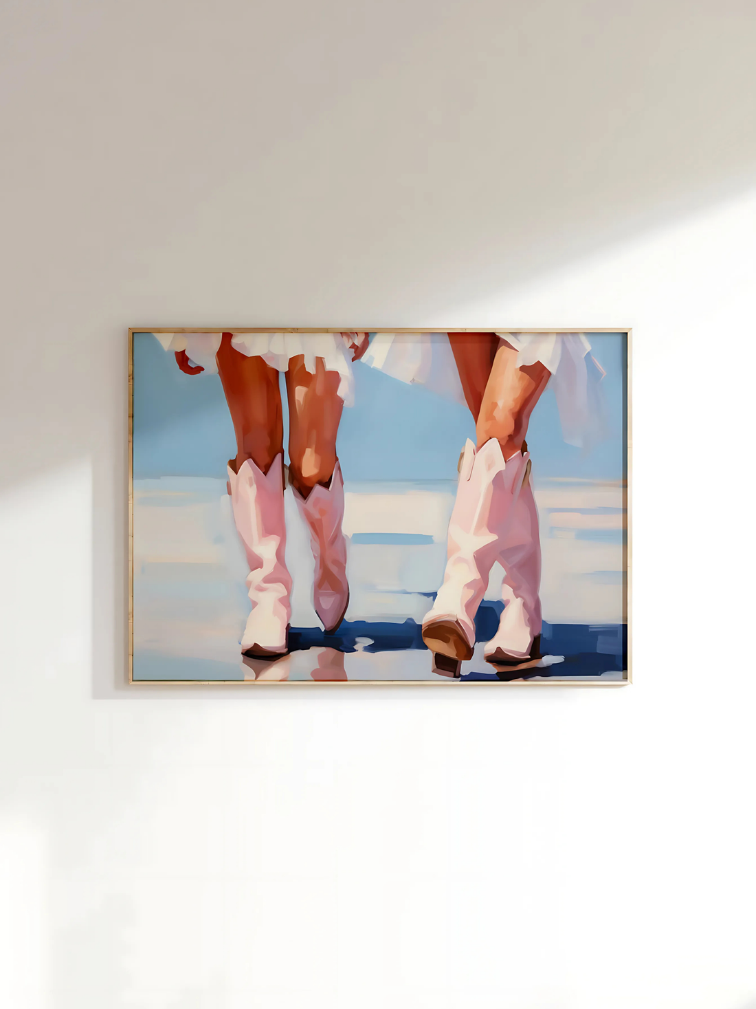Coastal cowgirl poster with pink and blue boots on a wall in a girly bedroom.