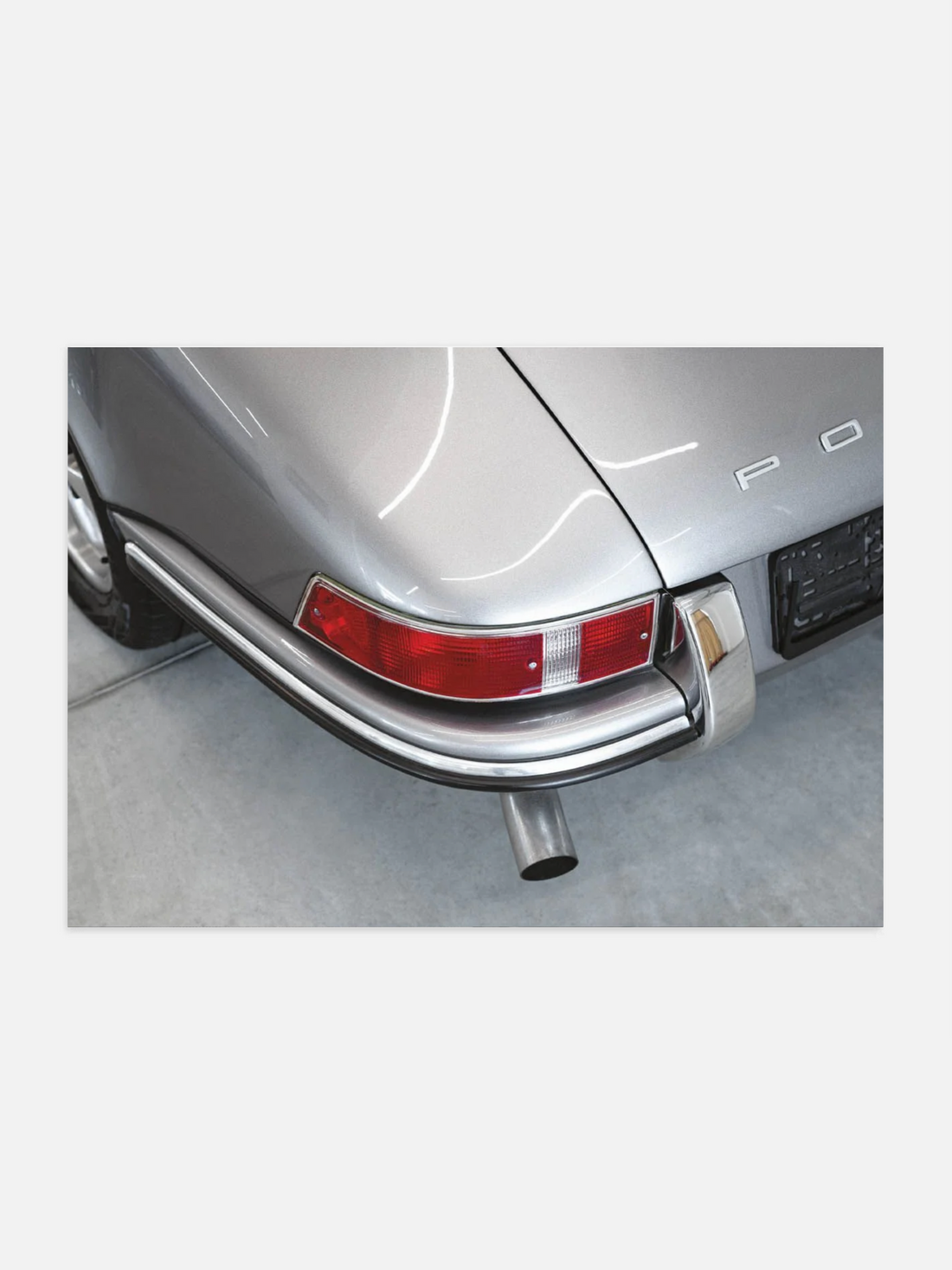 Rear light of a 1969 Porsche in close-up black and white photography
