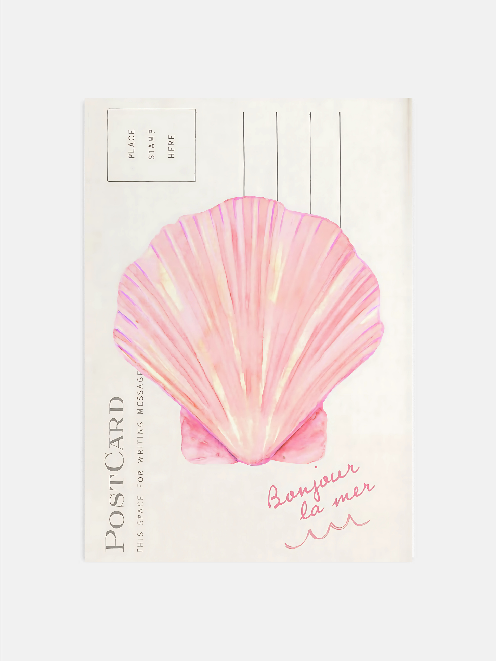 Coastal seashell wall art in pink hanging in a bright beachy bedroom.