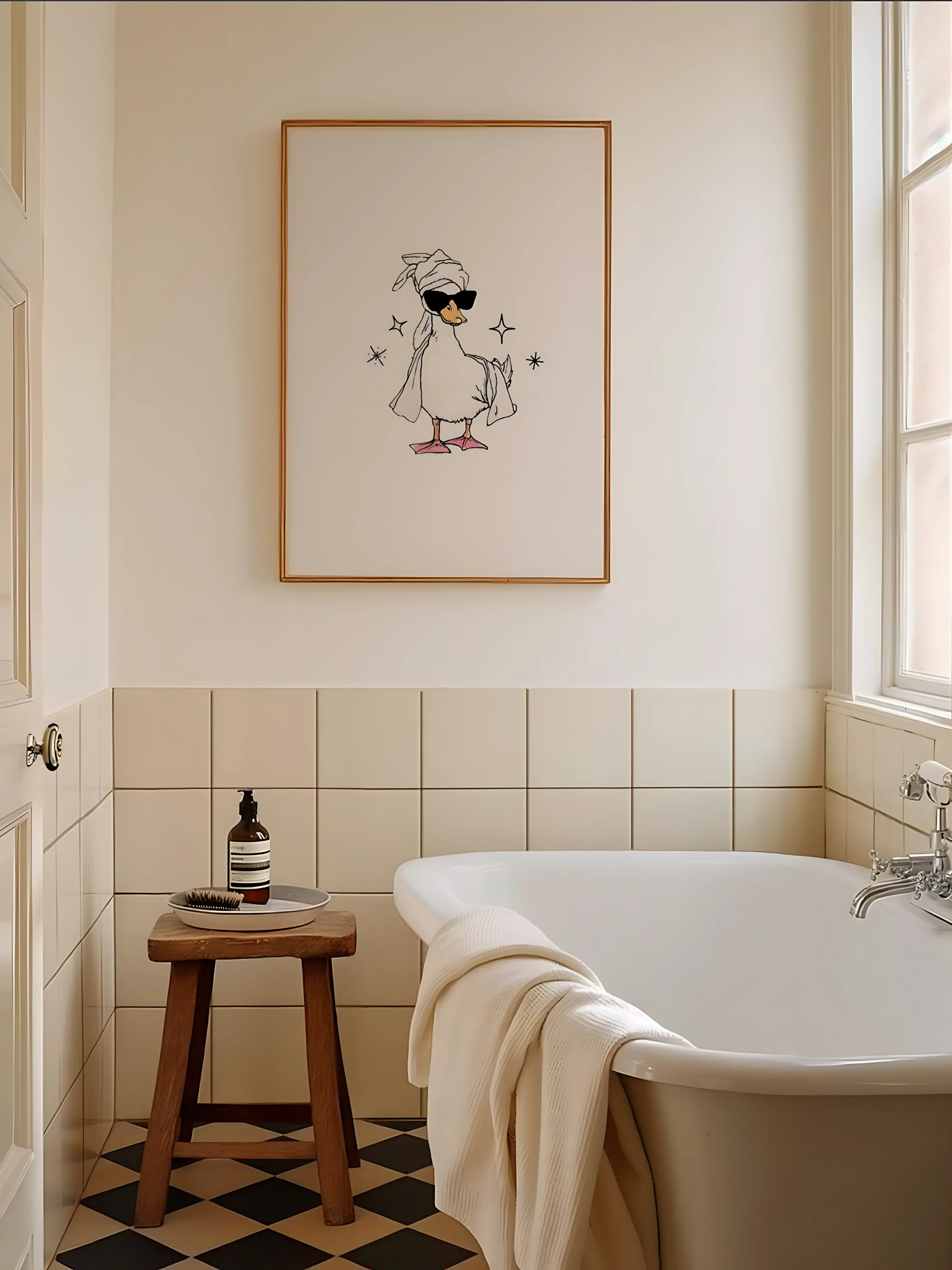 It girl bathroom with cute duck wall art and cozy towels.