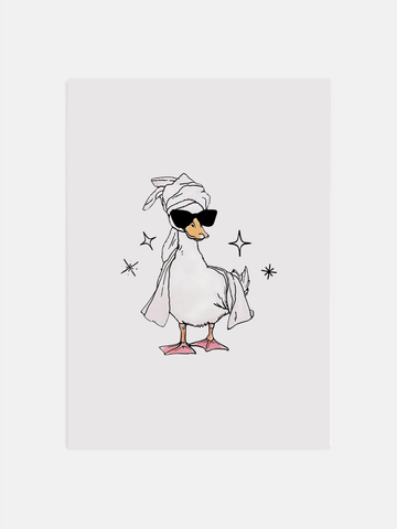 Cute duck wall art hanging in a trendy bathroom with minimal decor.