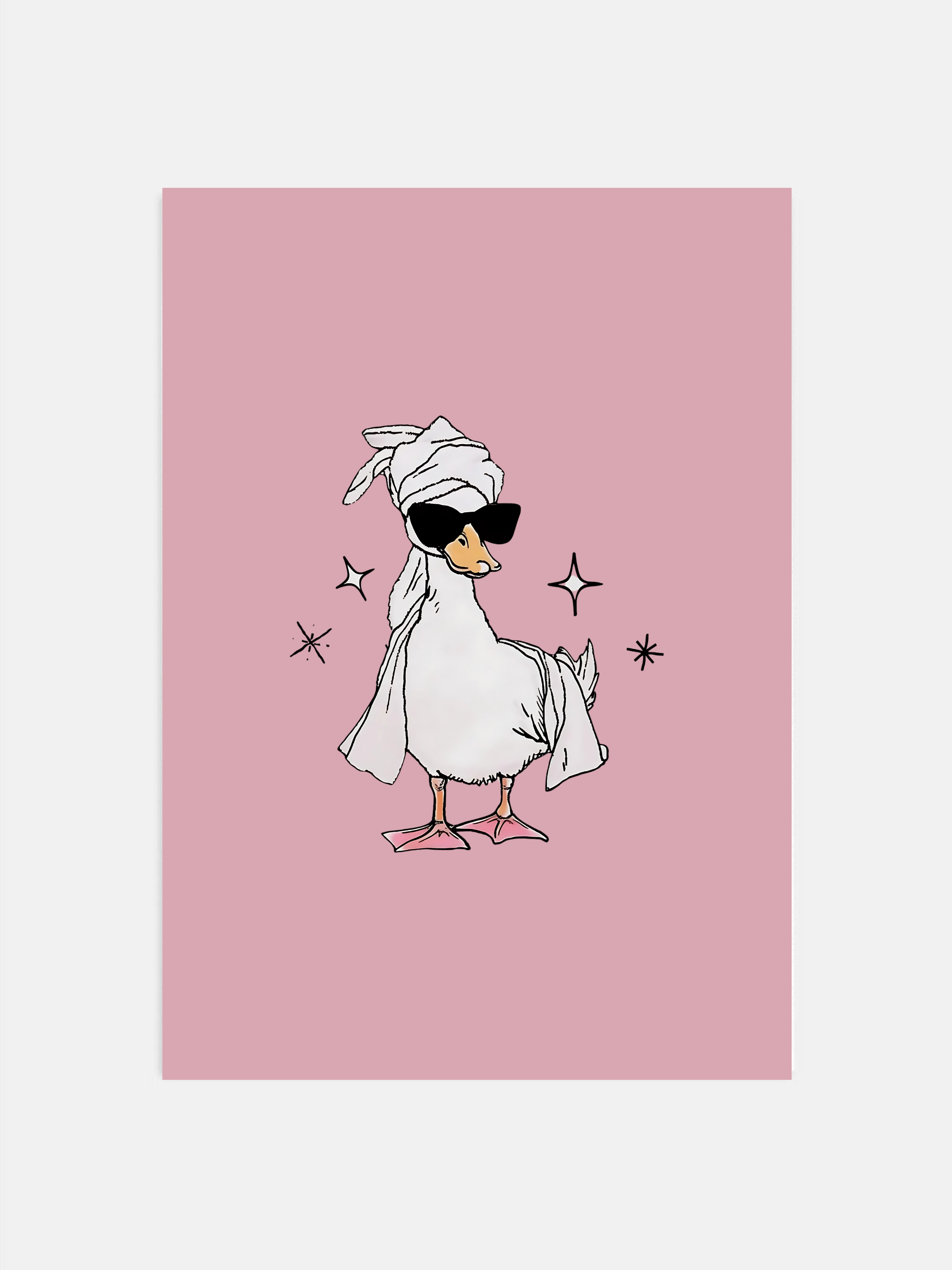 Duck in head towel wall art on dust pink background hanging in a girly bathroom.