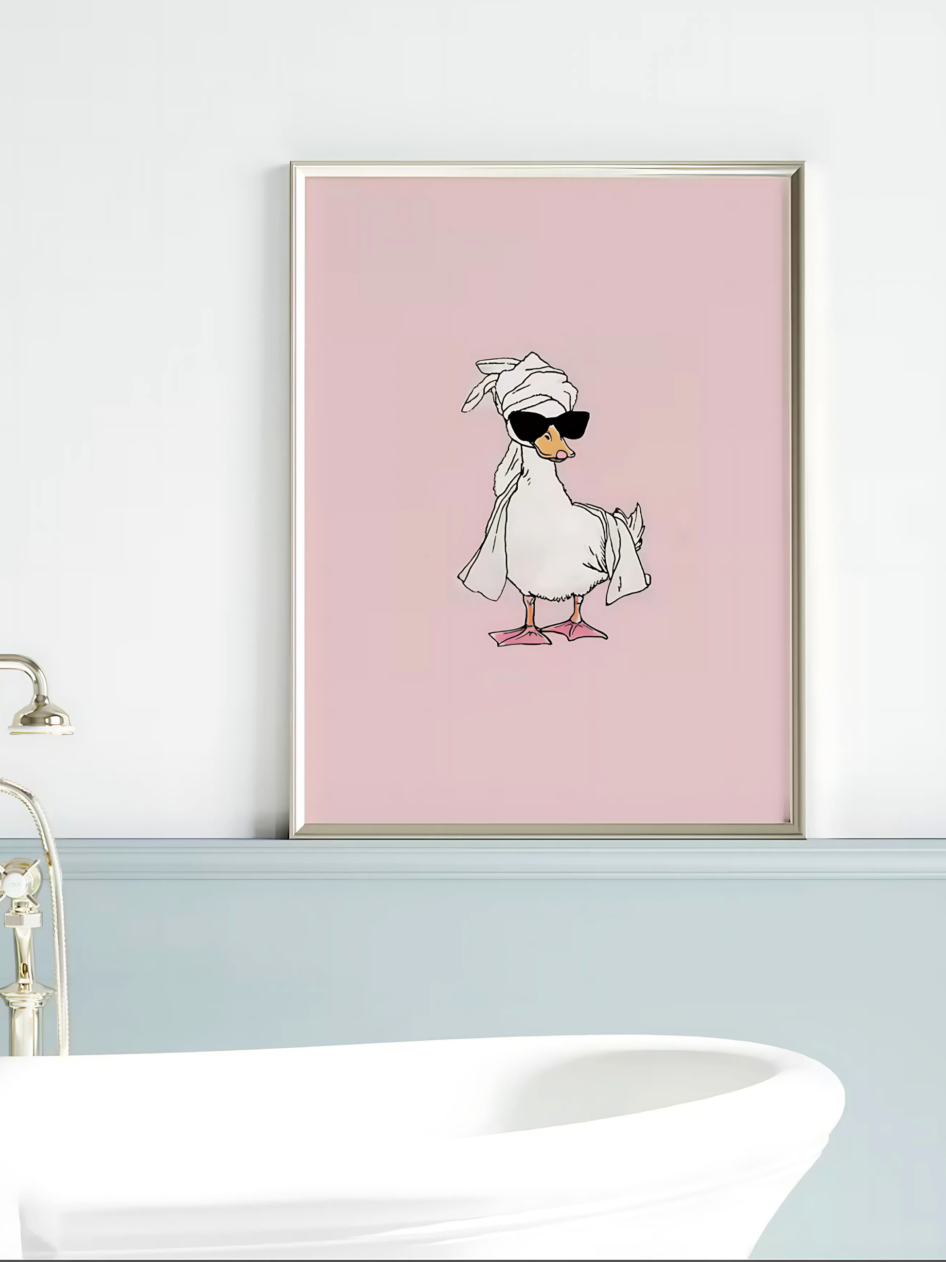 Trendy minimalist duck poster styled above a bathroom sink.