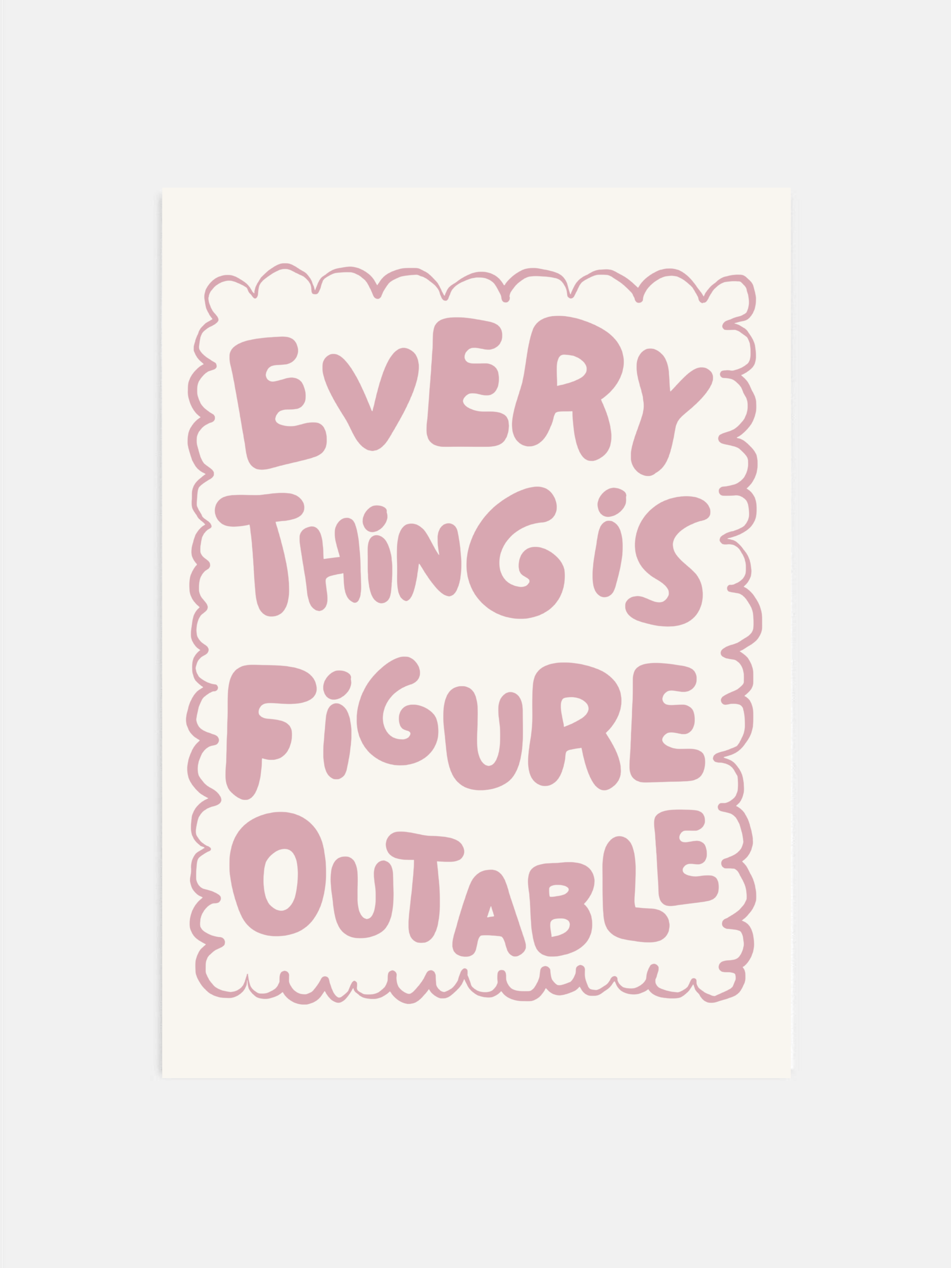 Everything Is Figureoutable print in dust pink and off-white hanging in an office.