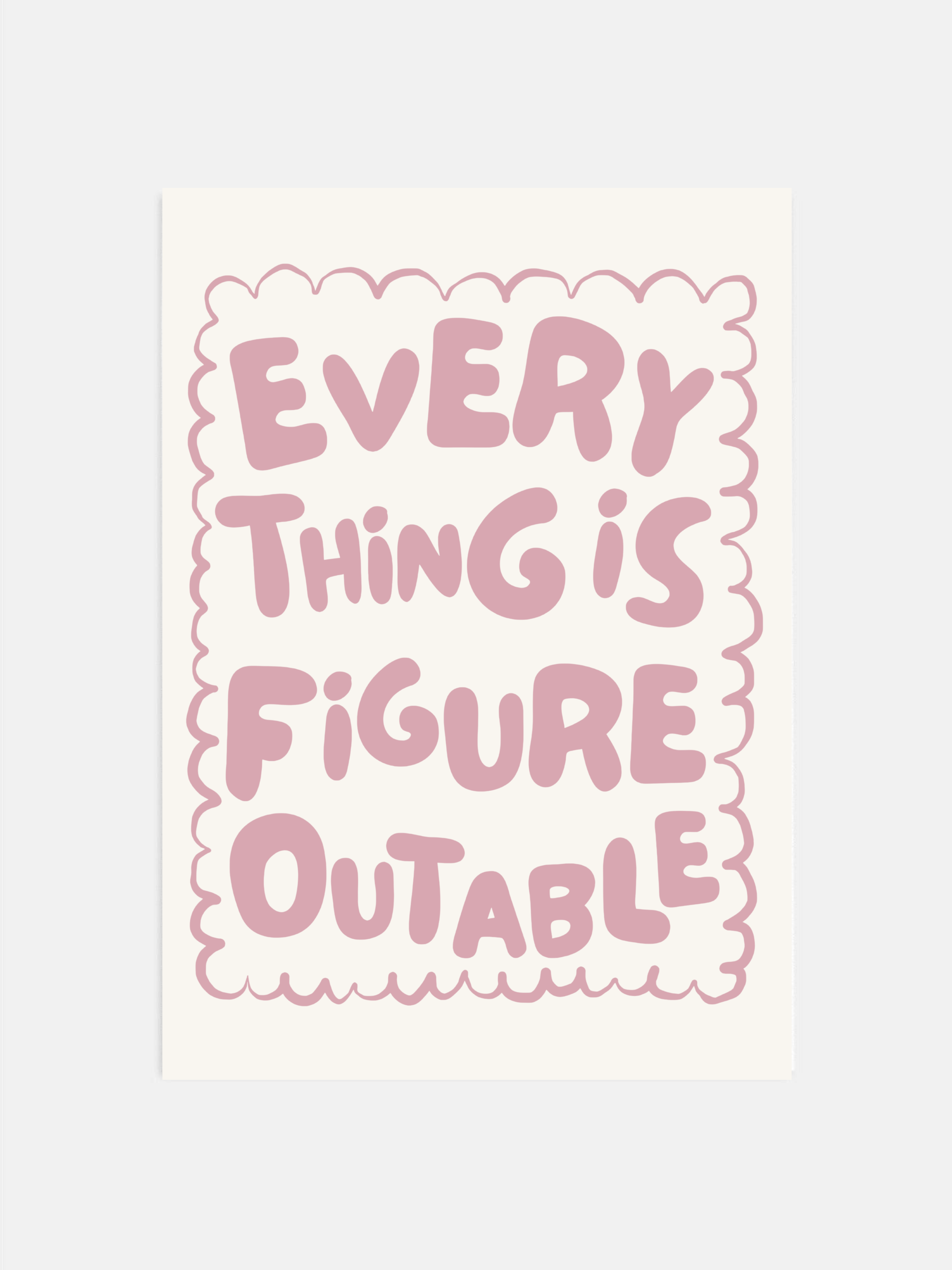 Everything Is Figureoutable print in dust pink and off-white hanging in an office.