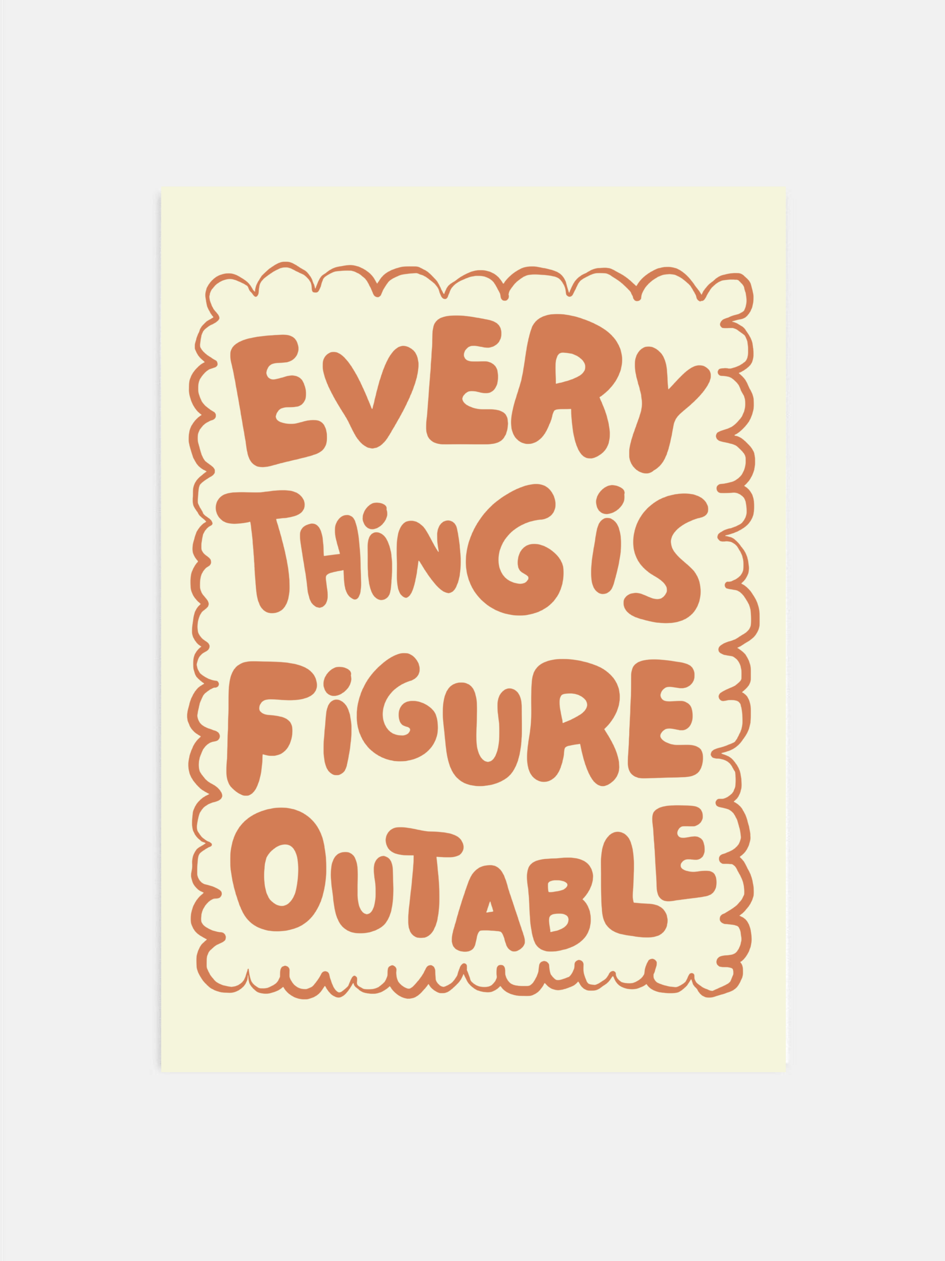 Everything Is Figureoutable print in earthy boho colors hanging in an office.