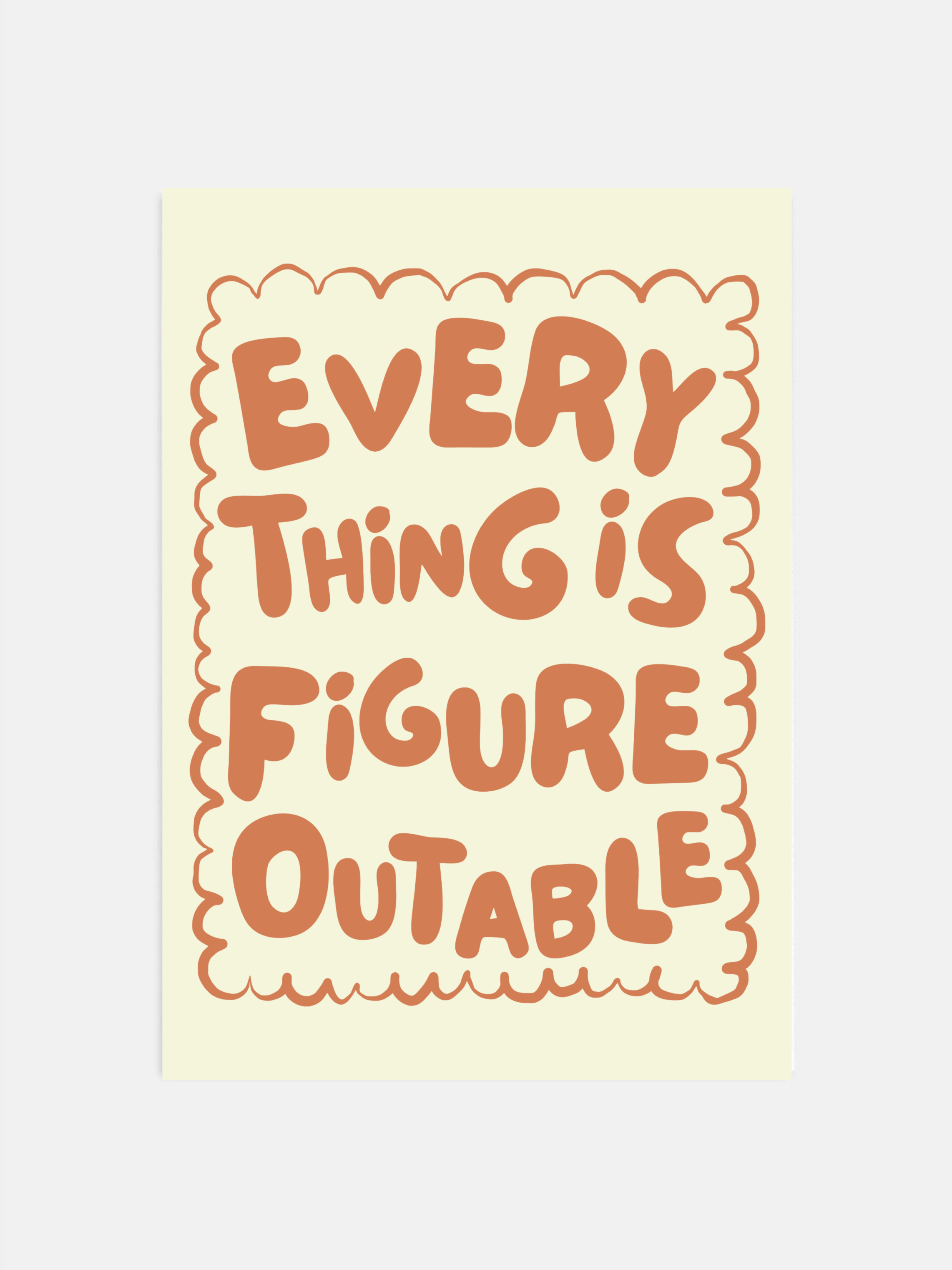 Everything Is Figureoutable print in earthy boho colors hanging in an office.
