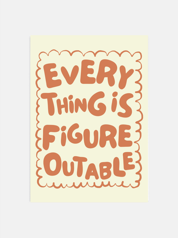 Everything Is Figureoutable print in earthy boho colors hanging in an office.
