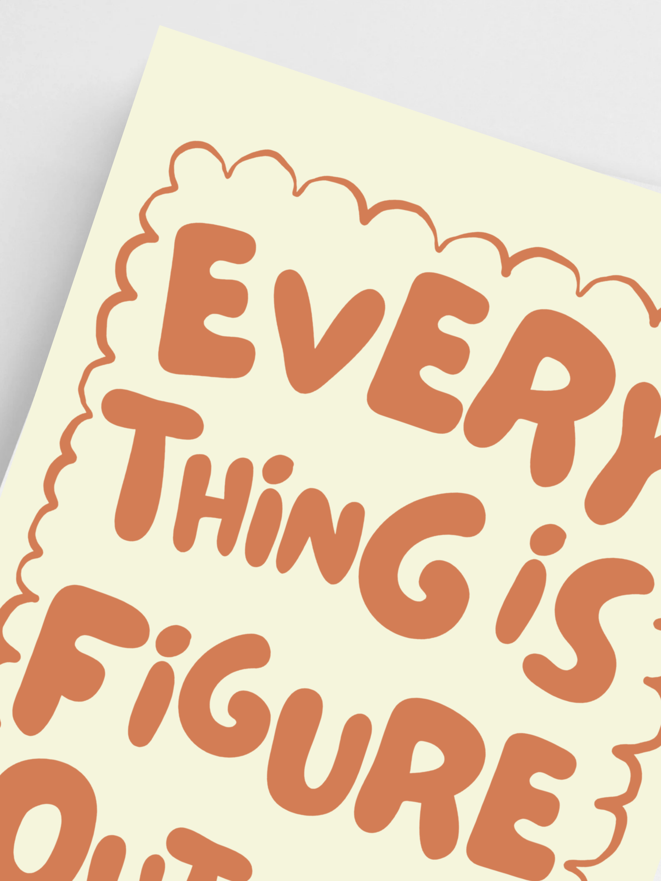 Close-up of inspirational quote poster with warm neutral tones.