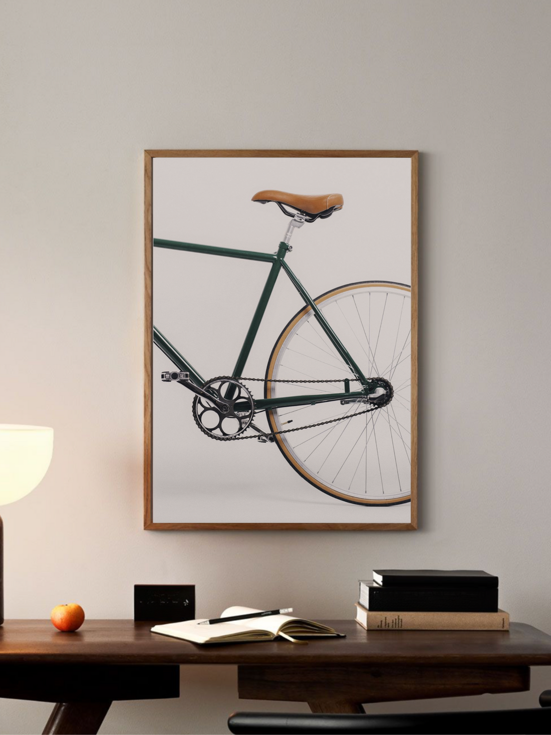 Green bicycle with a brown seat on a white background