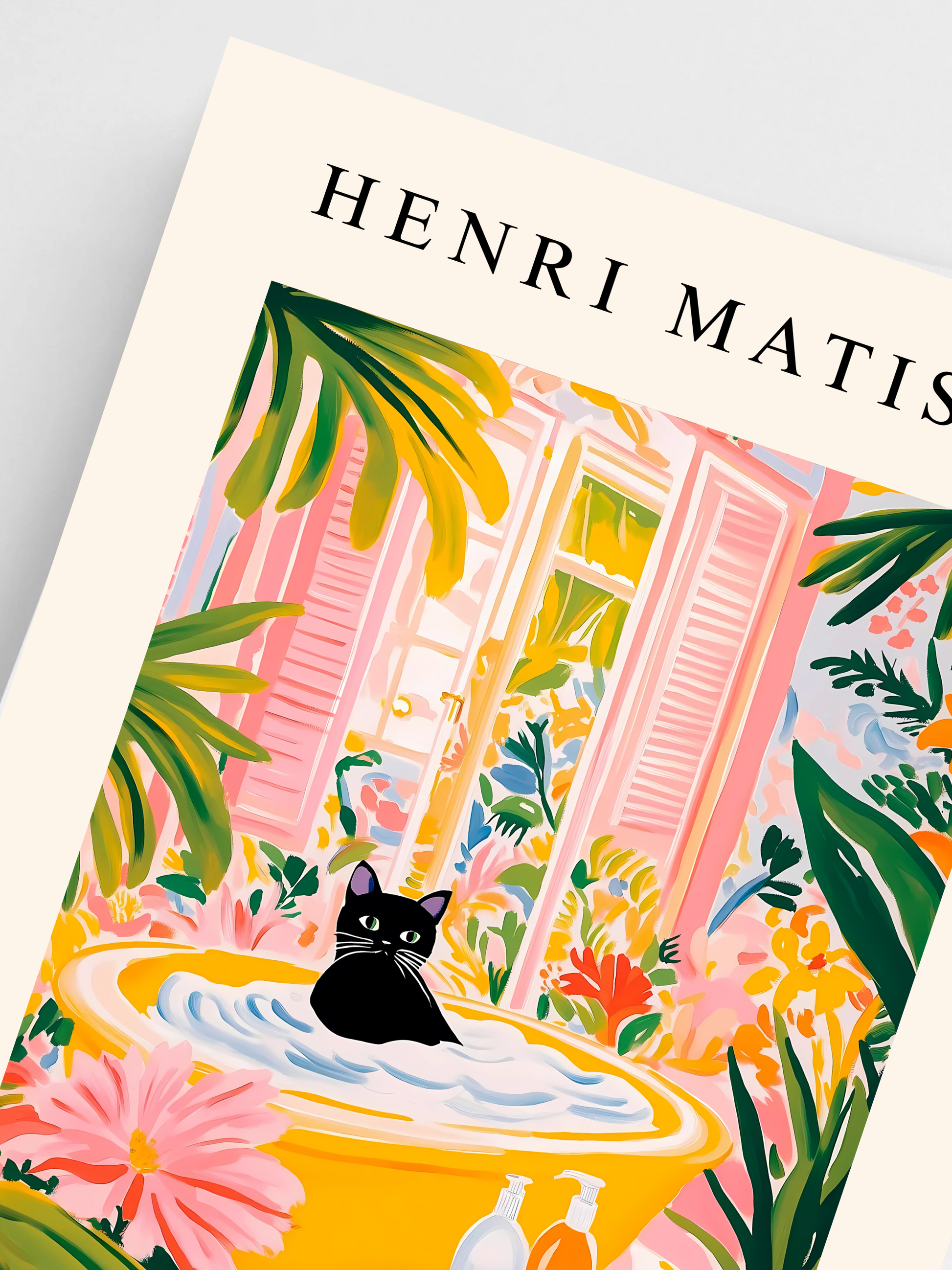 Close-up of funny black cat print with Matisse-style pink and green leaves.