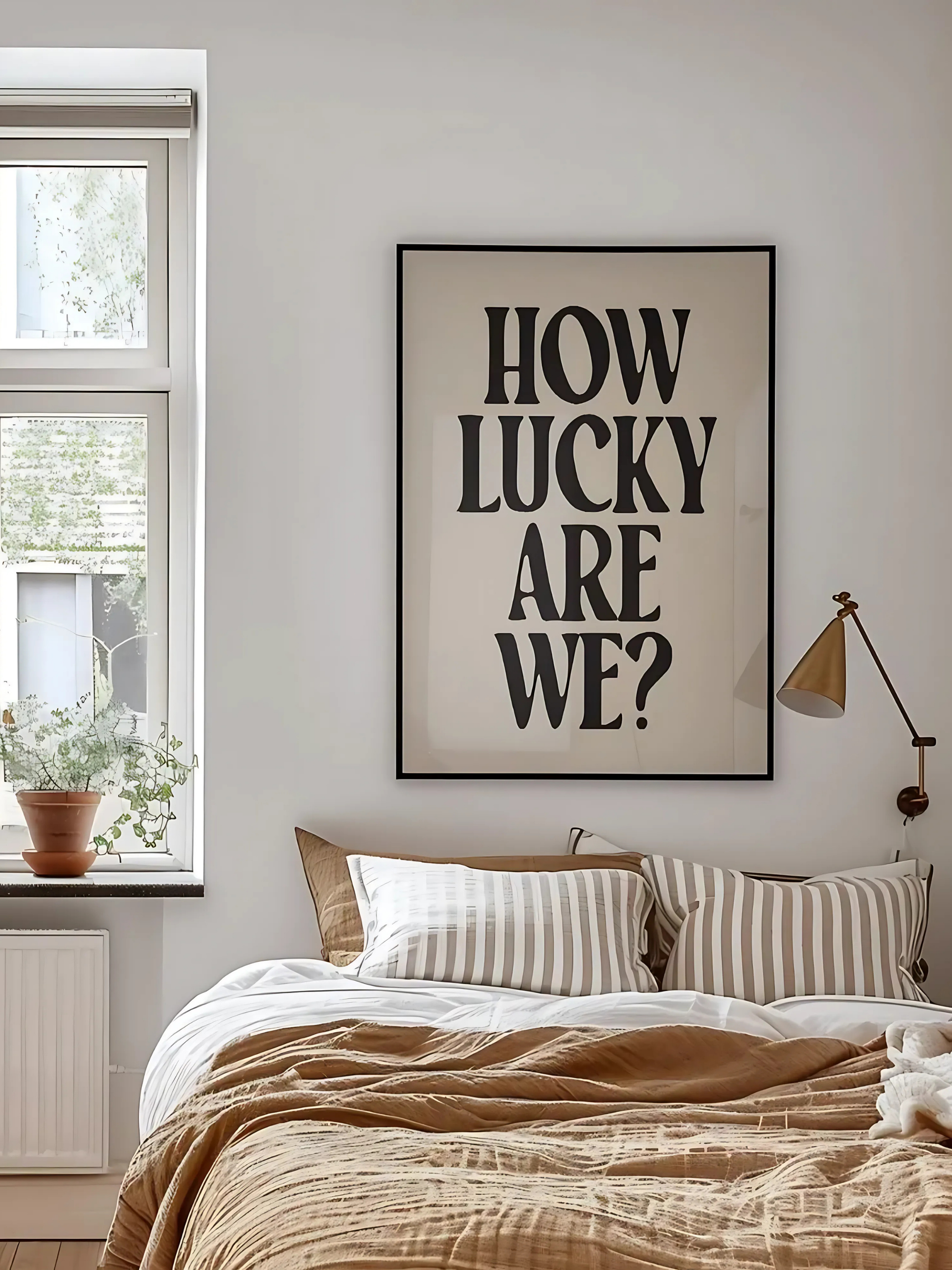  Close-up of How Lucky Are We print with bold black letters on white background.