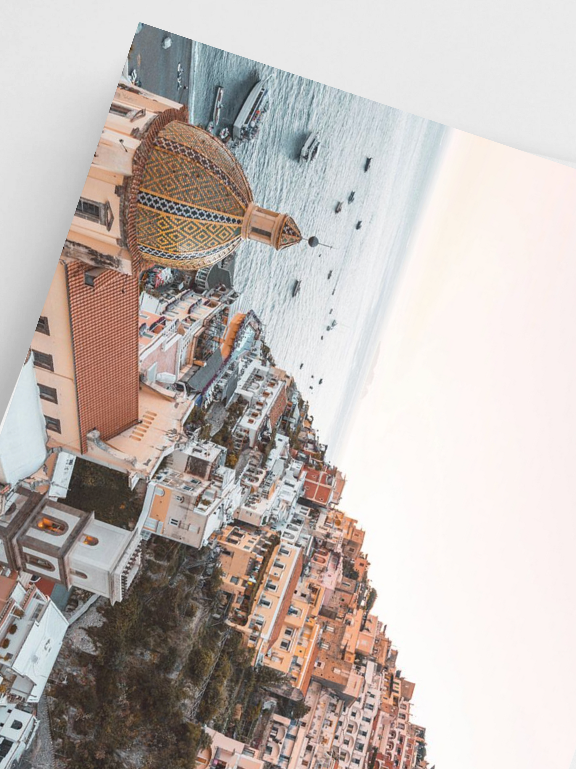 Positano poster adding warmth to a white-walled room