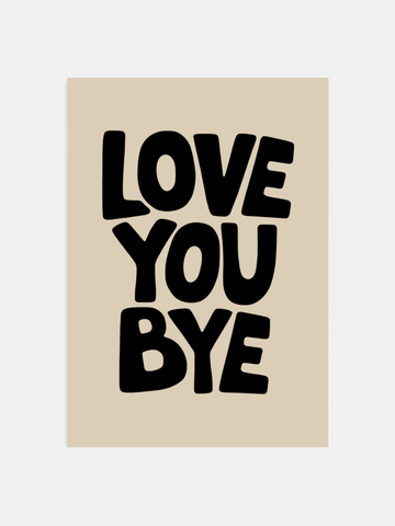 Love You Bye print in black on beige hanging on a bedroom wall.