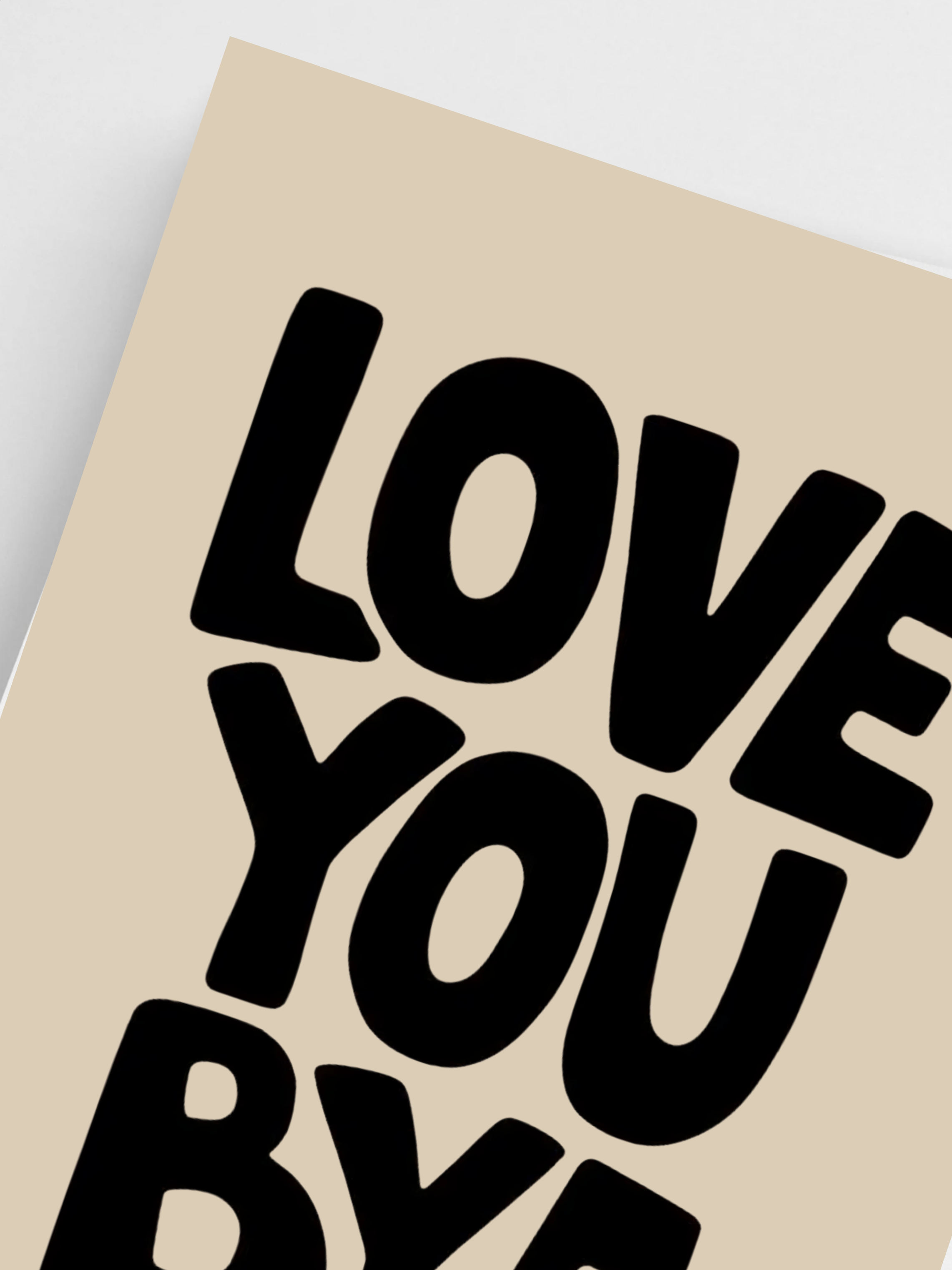Close-up of black typography Love You Bye wall art on beige background.