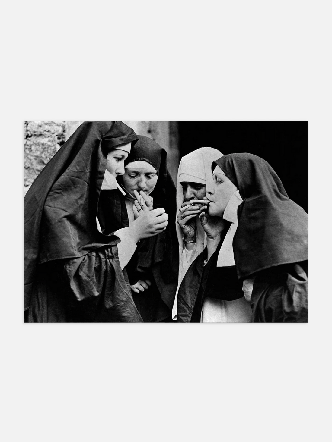 Black and white photo of nuns smoking cigarettes