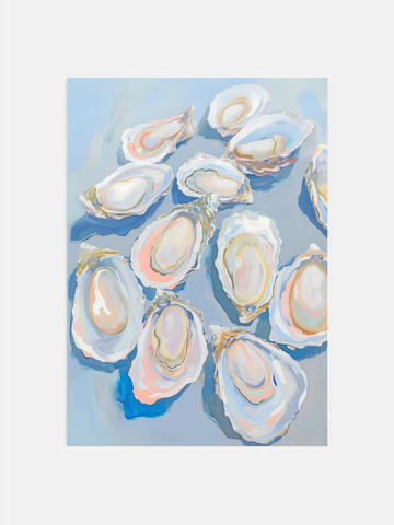 Pastel blue oyster shell art print hanging in a bright coastal kitchen.