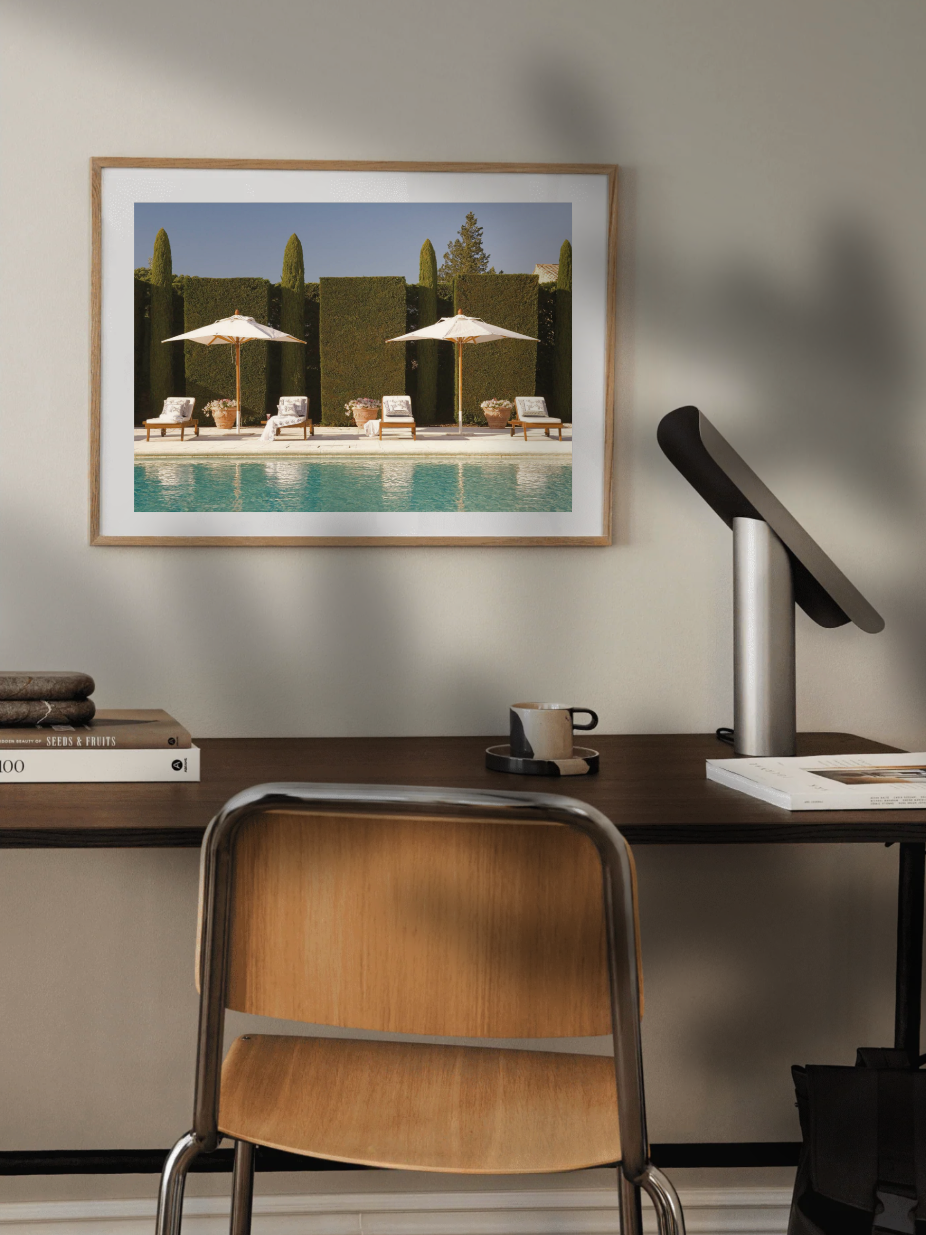 Summer-themed Poolside Dream poster above a home office