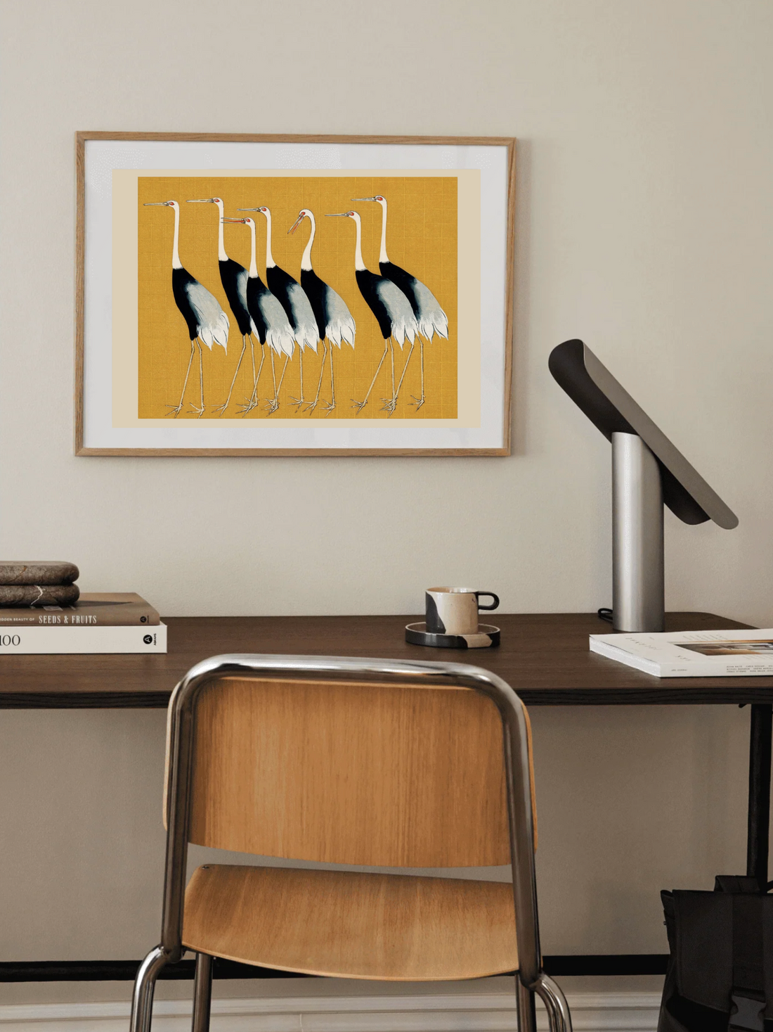 Japanese red crown cranes illustrated on a yellow background