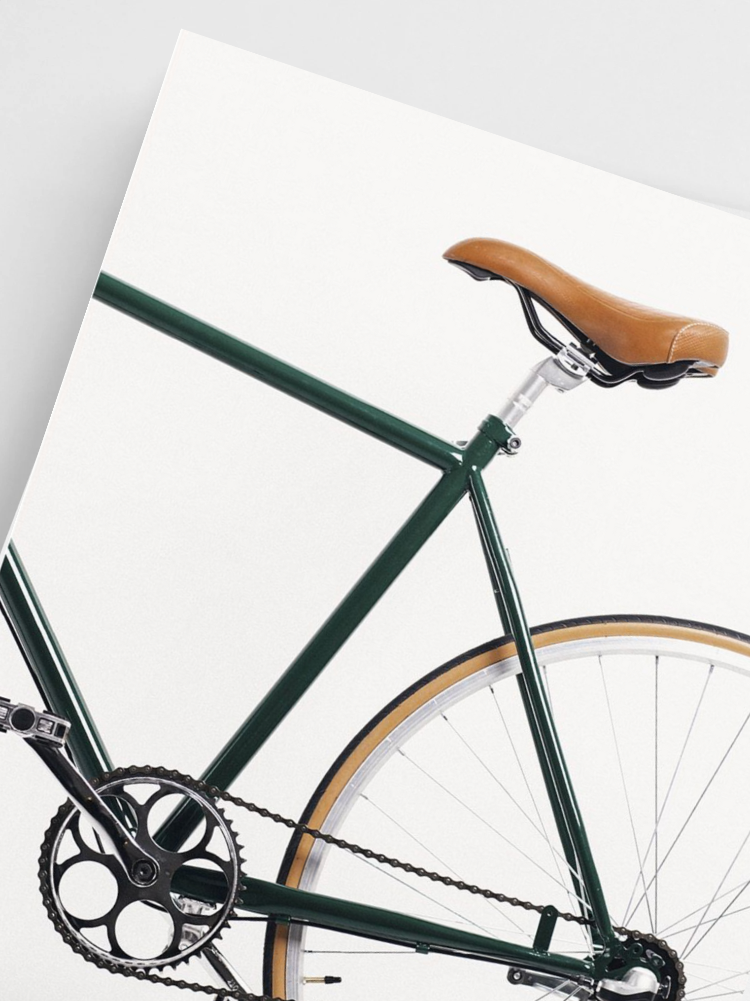 Close-Up Poster of Green bicycle with a brown seat on a white background