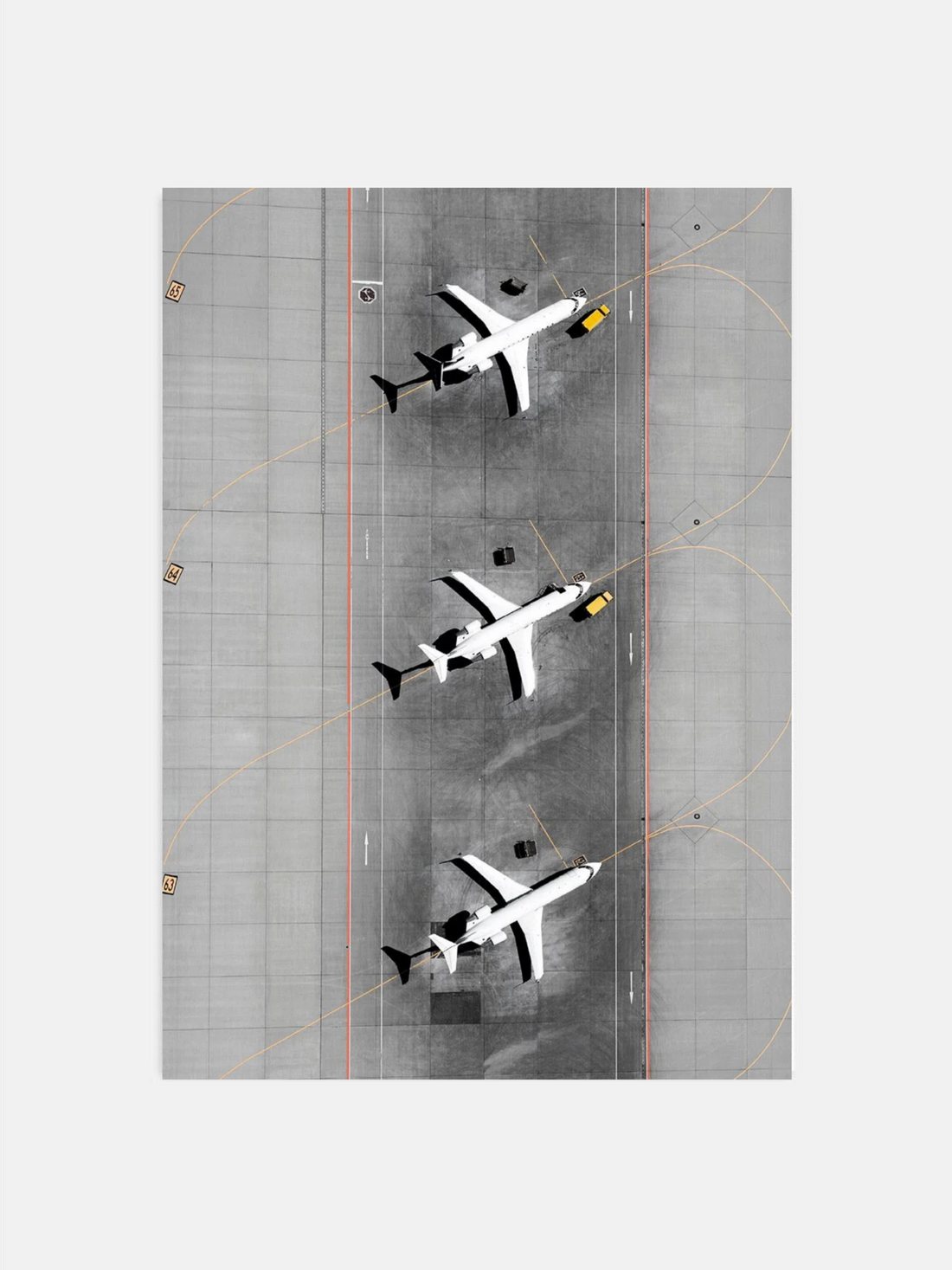 Overhead view of three airplanes on airport runway
