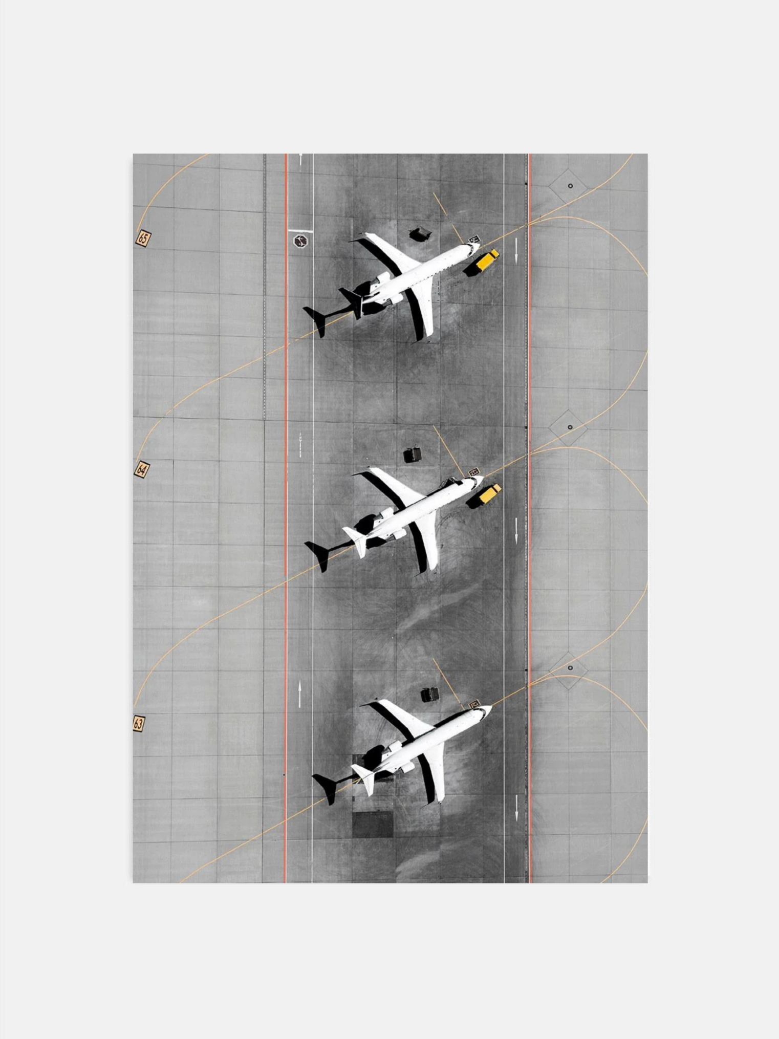 Overhead view of three airplanes on airport runway