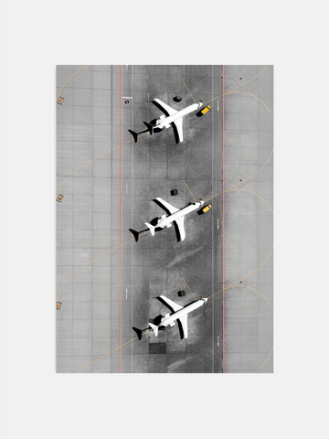 Overhead view of three airplanes on airport runway