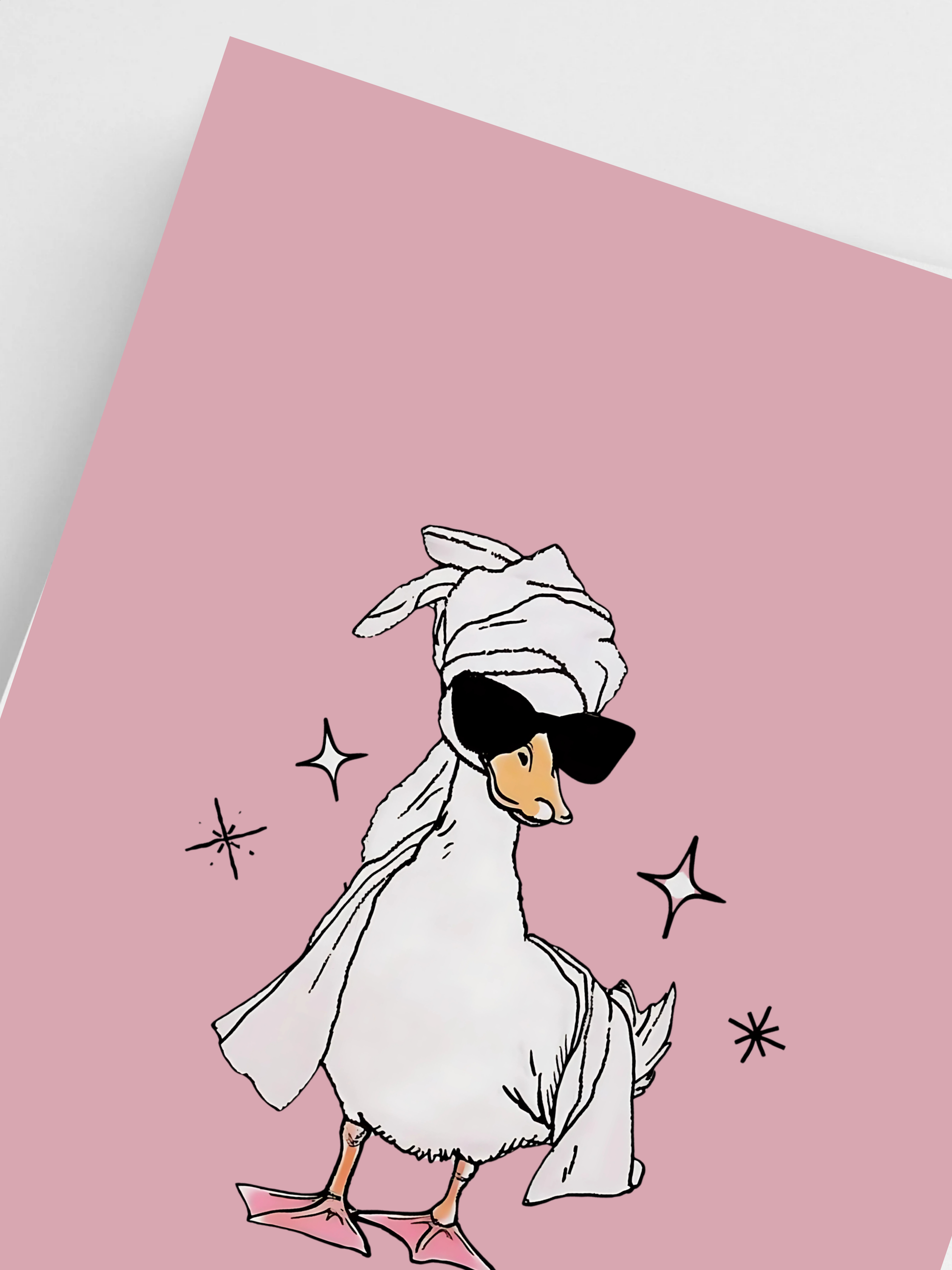 Close-up of cute duck print with towel wrap in soft pink tones.