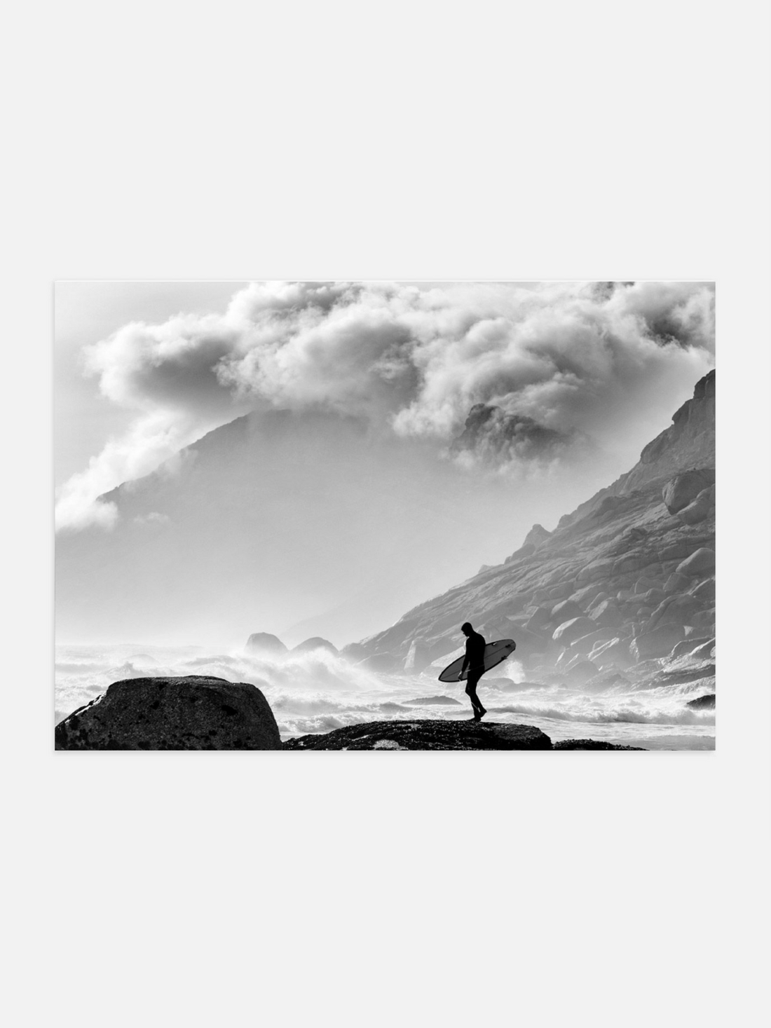 Surfer preparing to enter stormy ocean
