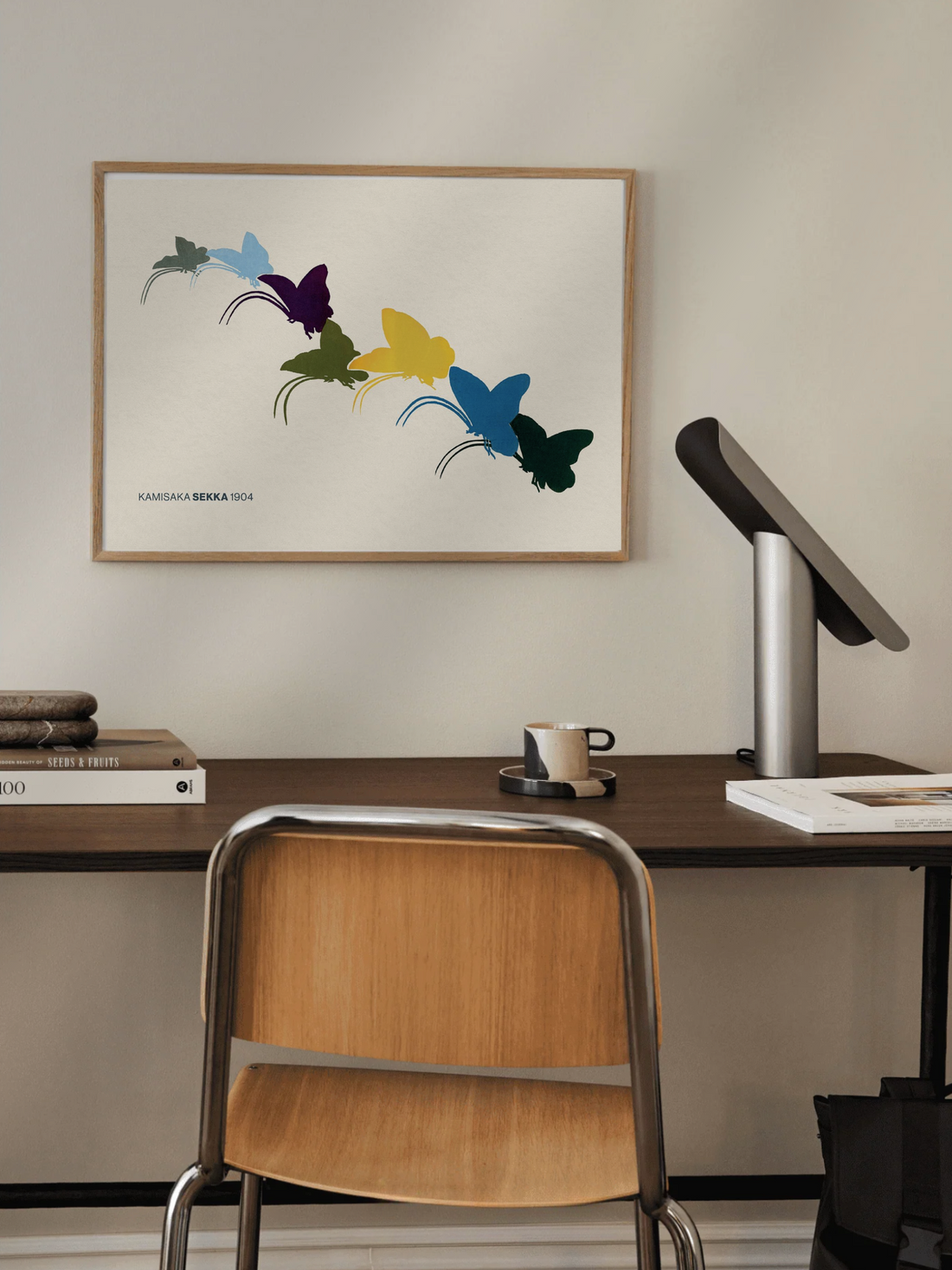 Colorful butterfly illustration on a beige background with 'Kansai Yamamoto' branding.