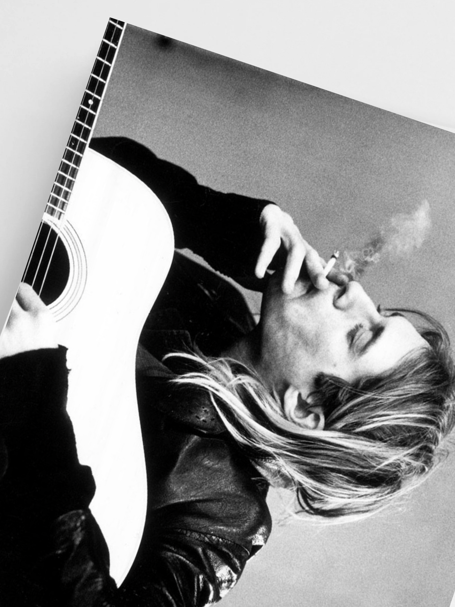 Close-Up Black and white photo of a kurt cobain holding a guitar