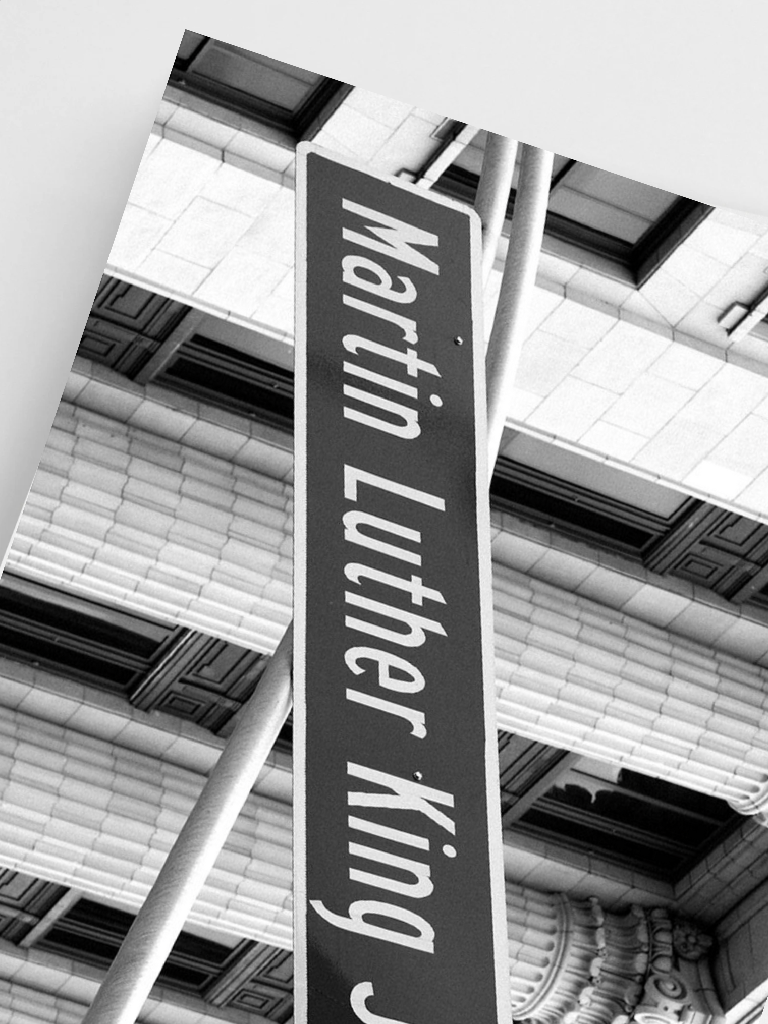 Street sign with 'Martin Luther King Jr.' on a building interior