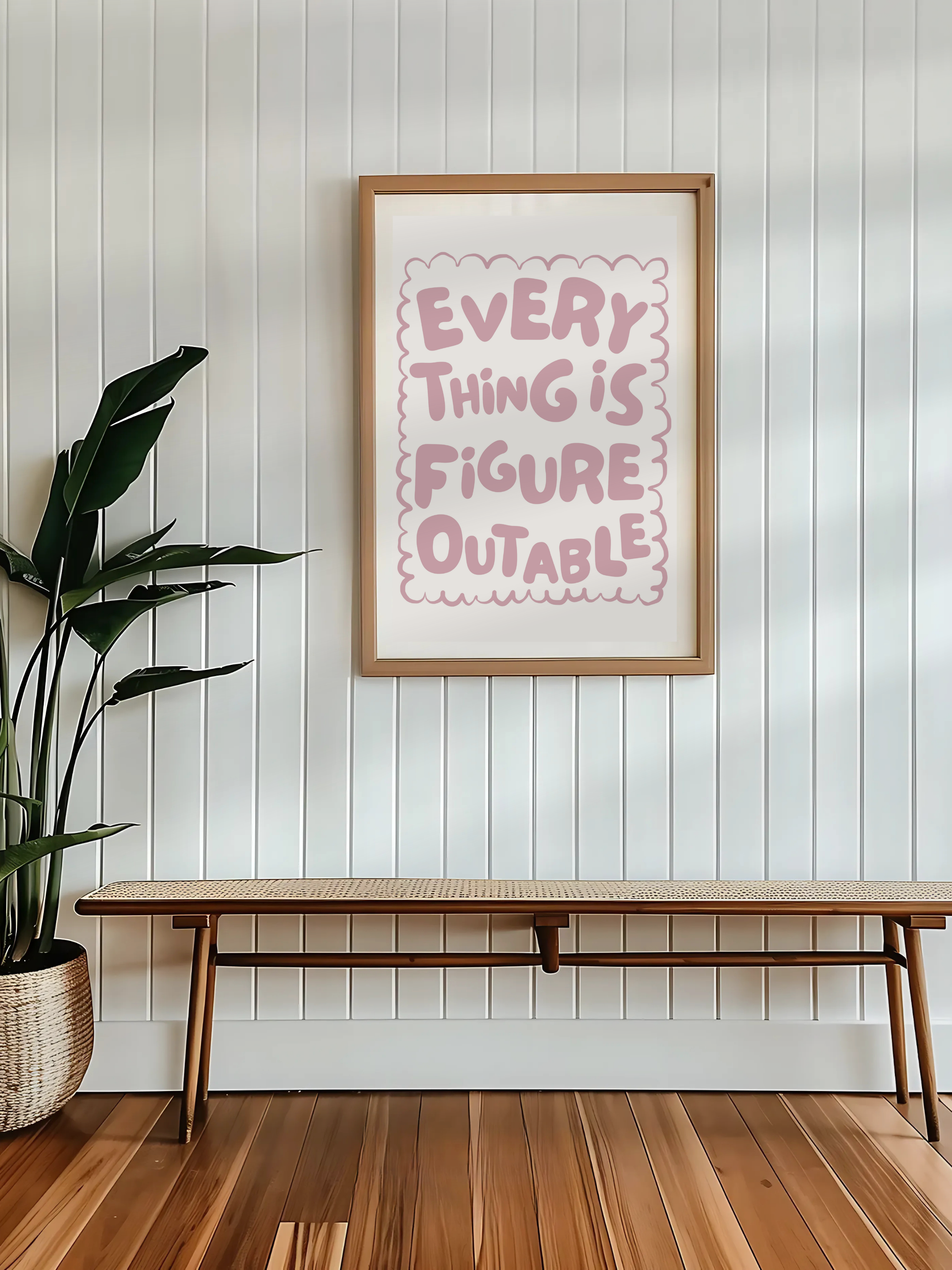 Uplifting Everything Is Figureoutable print adding a gentle touch to a reading nook.