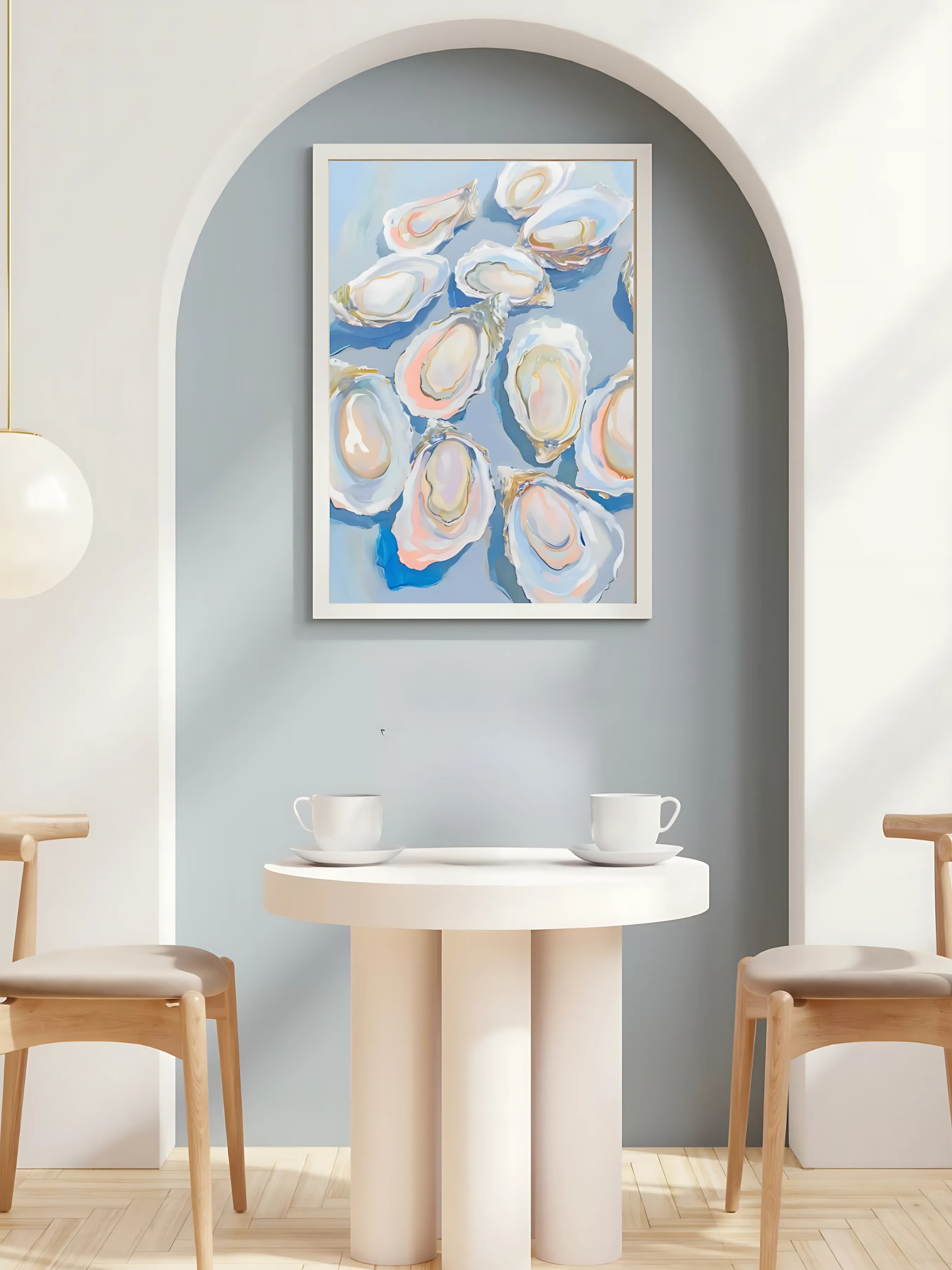 Framed artwork of oyster shells on a wall above a dining table with chairs.
