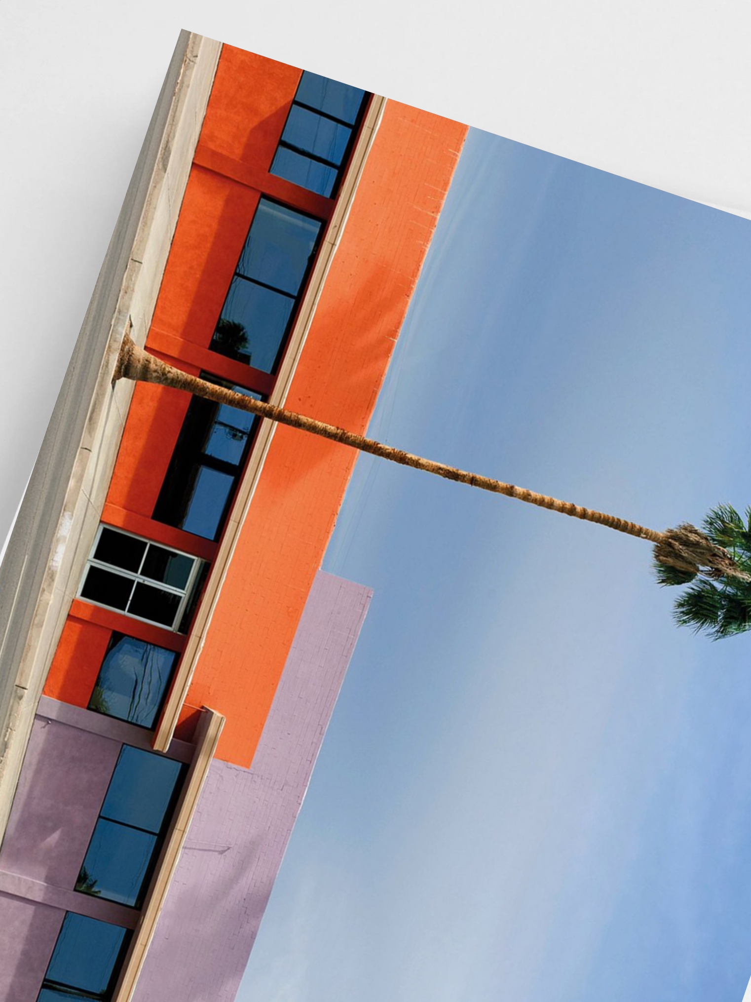 Modern building with geometric design against a clear blue sky