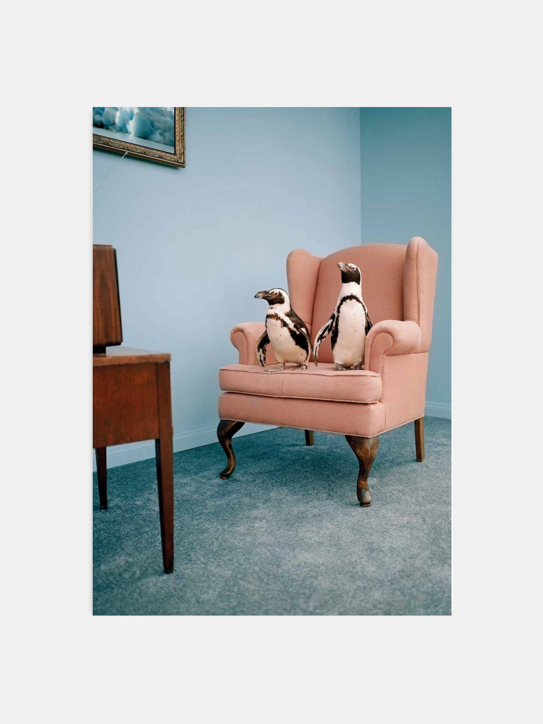Two penguins watching TV in surreal living room