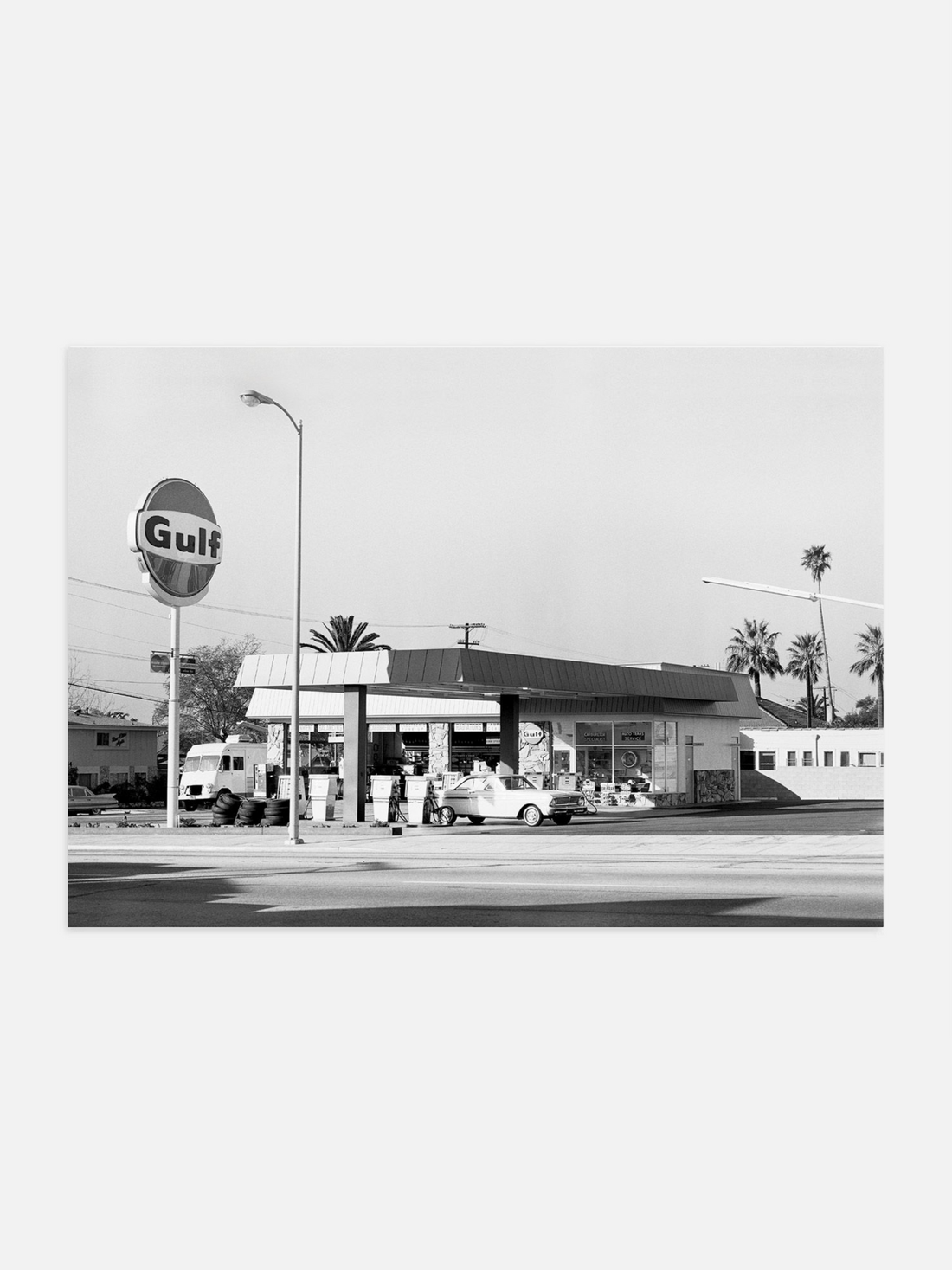 Black and white photo of an old-fashioned gas station